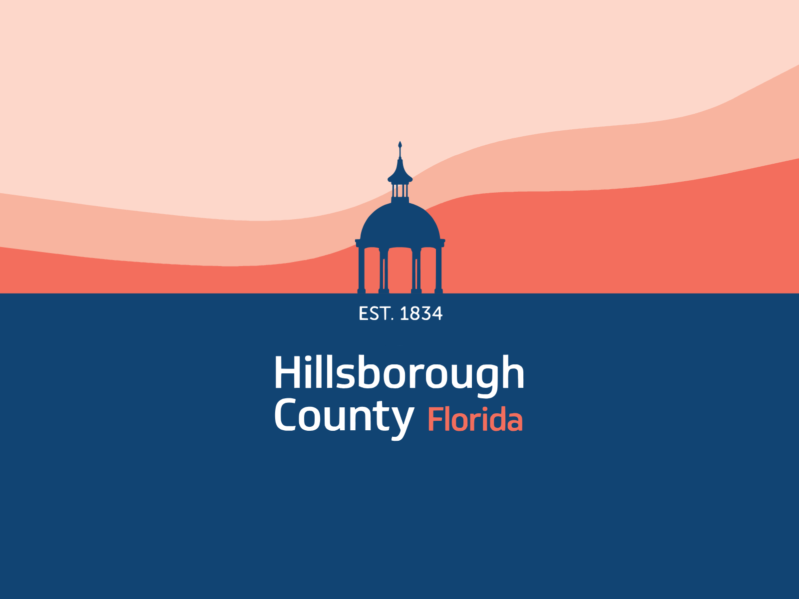 Hillsborough County emblem: a navy domed cupola against a coral sky, above the words Est. 1834